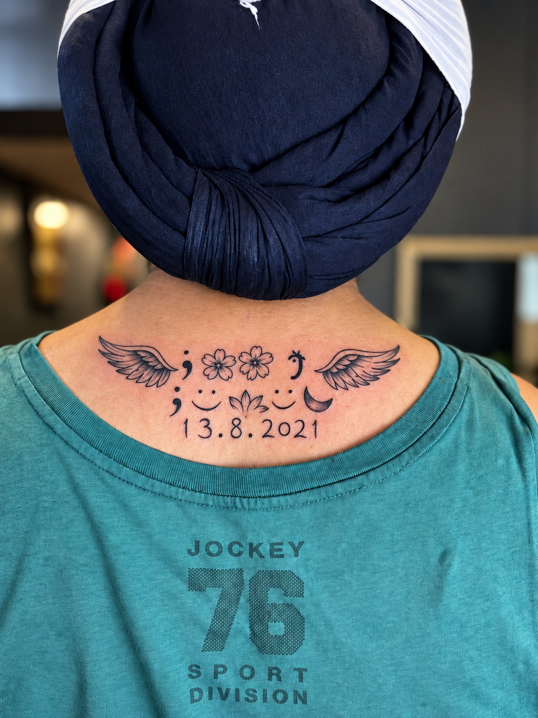 Hidden name tattoo neck design with wings and symbols West Delhi MJ's Tattoos Paschim Vihar